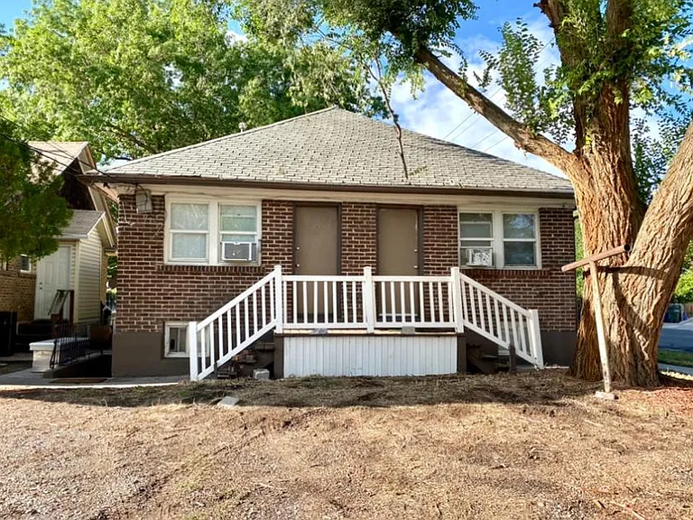 Back of property with parking area.