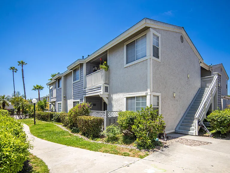 One of the two-story apartment buildings at Presidio Villa Apartments.