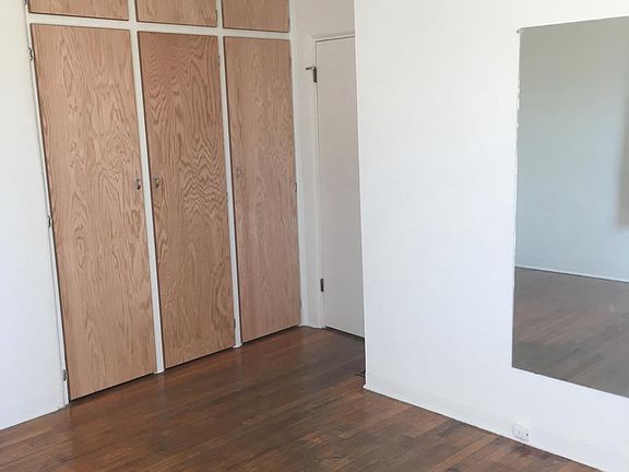 Bedroom 2 - Refinished floors & closet doors
