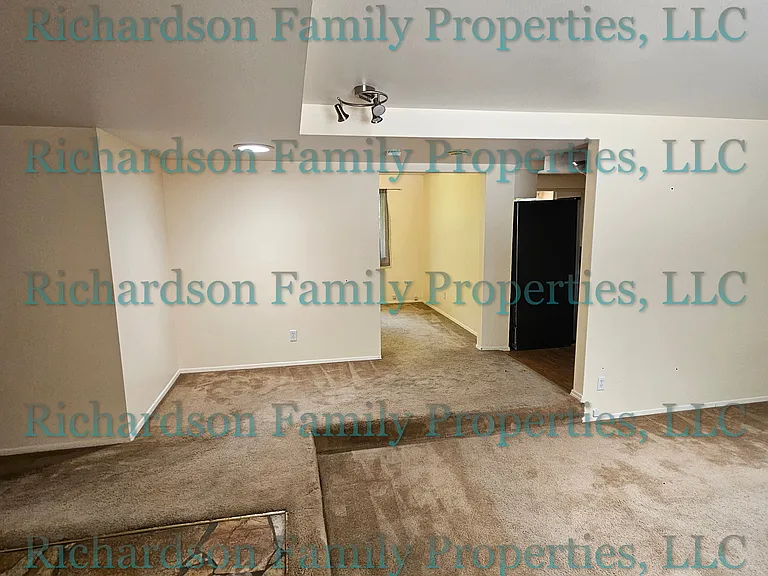 entryway facing den/playroom and kitchen