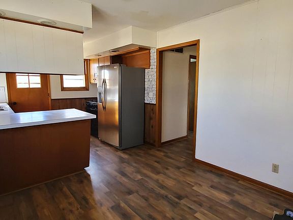 Dining area, kitchen, hallway entrance to main bathroom, bedrooms hallway shown here facing southwest.