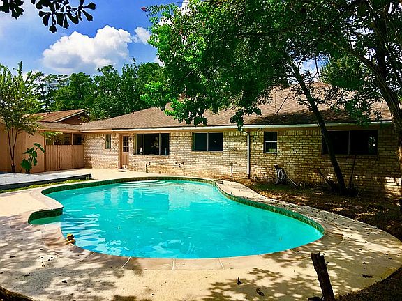 Sparkling pool with newly painted decking