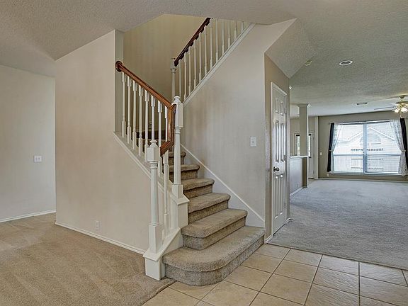 Inviting split staircase accesses the second floor where the 4 bedrooms, gameroom and 2 full baths are located.