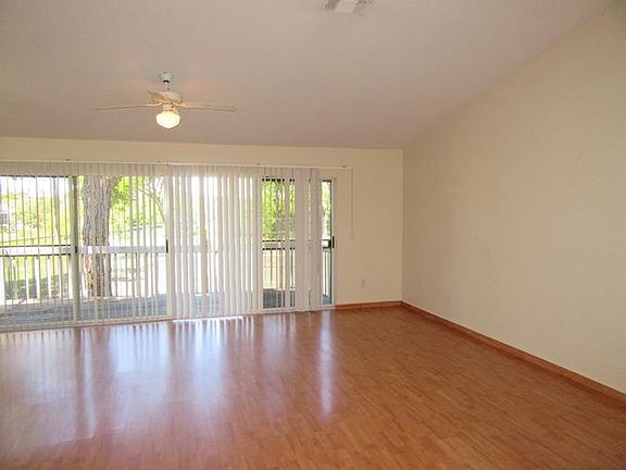 Light and bright family room with sliders to balco