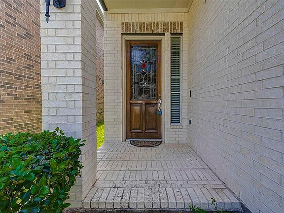 Covered front porch with brick pavers