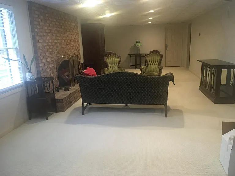 With cozy wood-buring fireplace