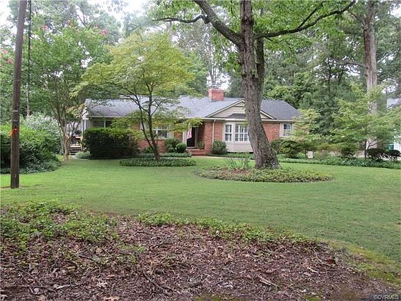 Well positioned brick ranch on 1/2 acre