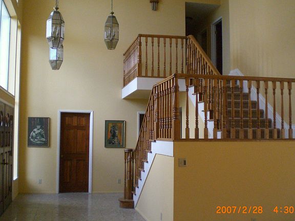 Front Entrance With Tile Floor and Double French Door.