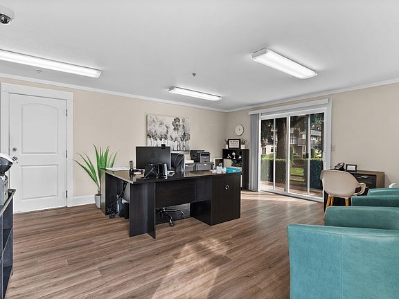 Welcoming leasing office with modern furnishings and natural light.