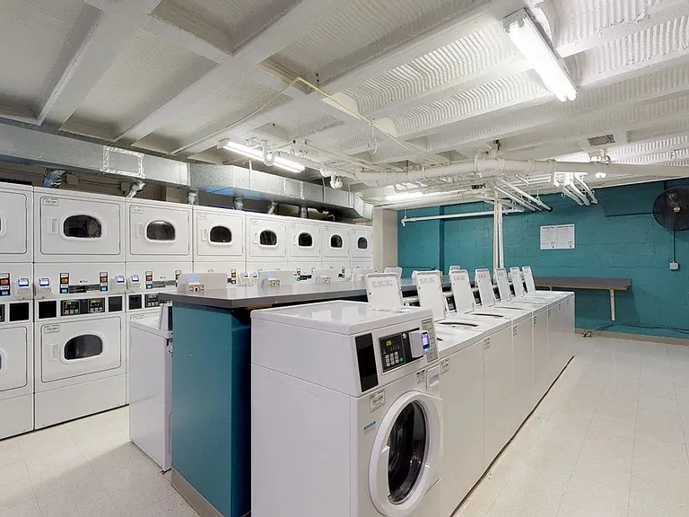 Spacious community laundry room with folding space