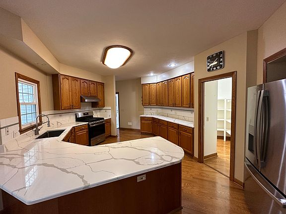 spacious eat in kitchen with walk in pantry.