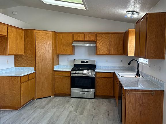 Kitchen with new stove, refrigerator and dishwasher
