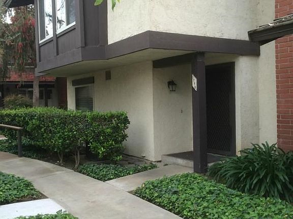 front entrance from main road, aspen village way (garage door located directly across from unit fron