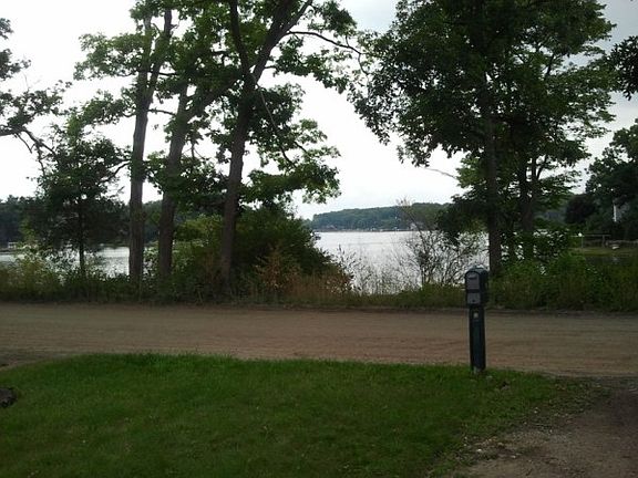 Big Lake across the street as seen from driveway. Small community beach area about 50 yards down the road to the left. Public boat launch one tenth of a mile around the corner.