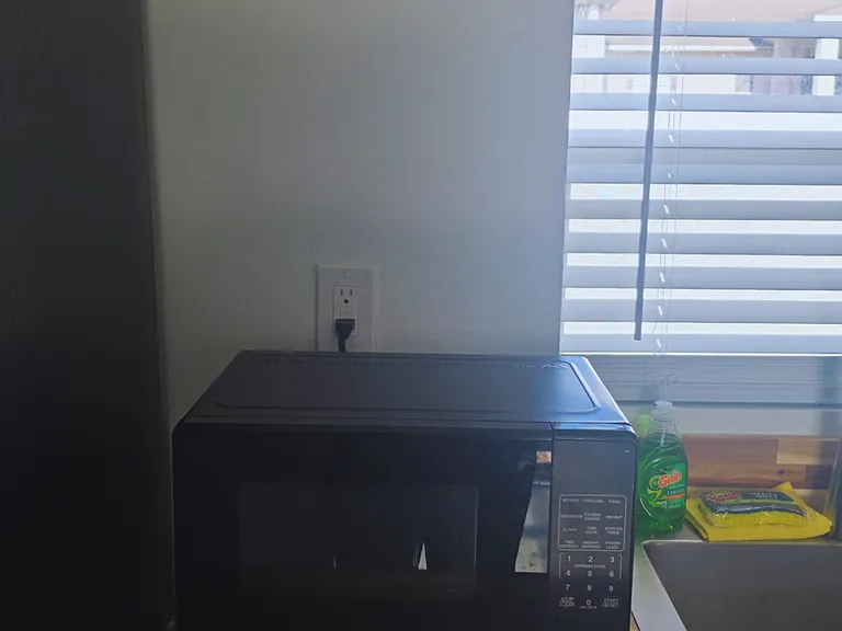 Includes microwave, dish soap, towel set, and essential amenities