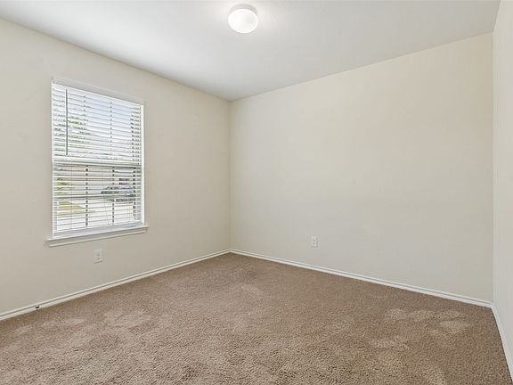 Neutral tone walls with white trim
