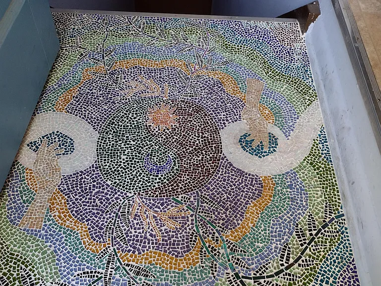 mosaic entrance created by a tenant