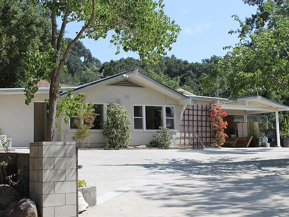 At the end of the lane Main House with Guest House far right.