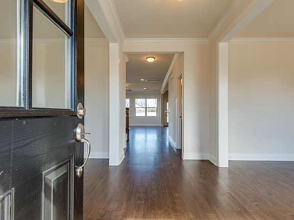 Double Doors, Wide Foyer with Cased Openings
