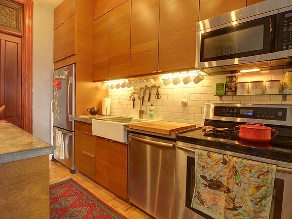 The kitchen was added in 2012. Dishwasher, induction cooktop, microwave, fridge and concrete counters.