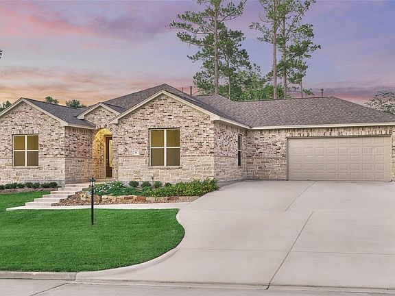 This home has upgraded landscaping with a grand stair entrance, leading guests beautifully to the front door.