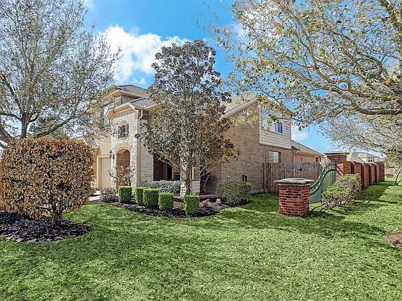 This beautiful home sits on a corner lot and is adjacent to a greenbelt and cul-de-sac on one side and at the back of the property. A brick wall along one side of the property is maintained by the HOA.