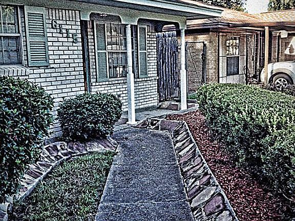 Lush landscaping walking to the front door.
