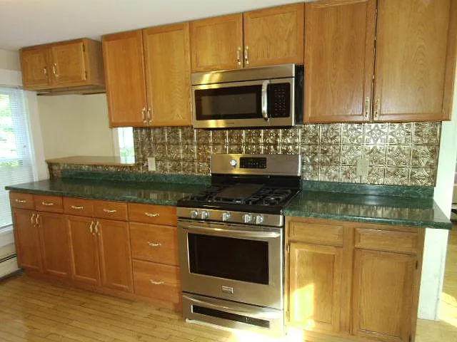 Kitchen looking toward room behind pass- through on left.