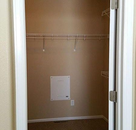 Huge master walk-in closet with built-ins