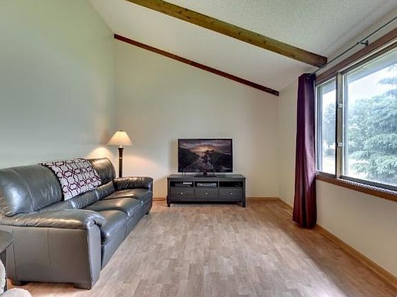 Big living room with vaulted ceilings and wood beams
