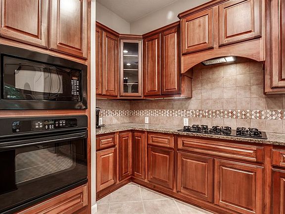 Kitchen view with lazy Susan in corner bottom counter.