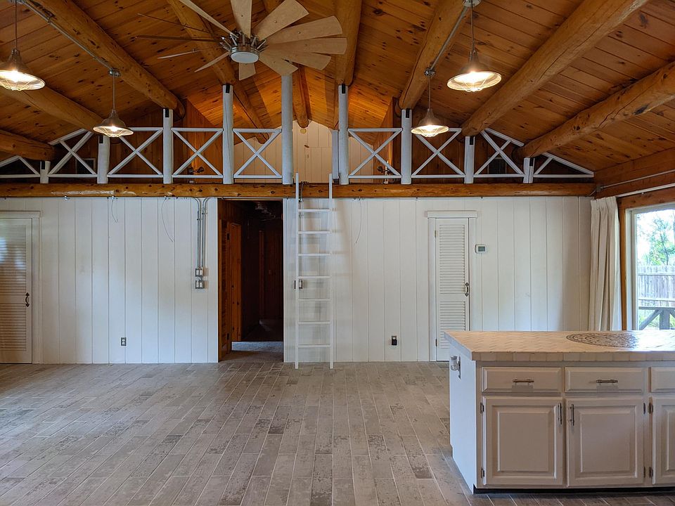 View from the kitchen of dining area and loft upstairs.