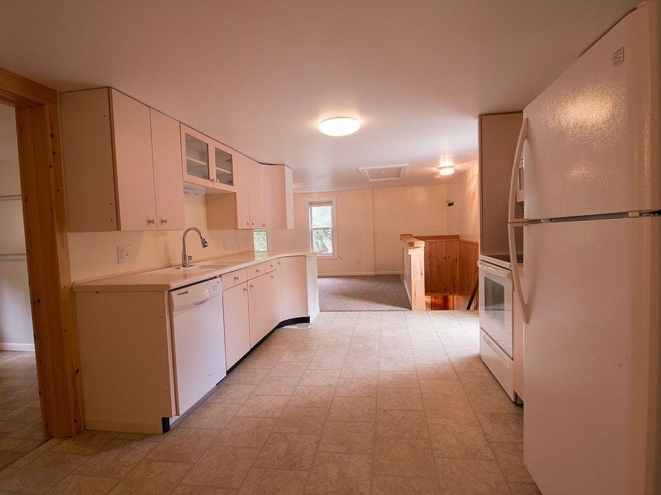 Kitchen connects between living room and dinning room