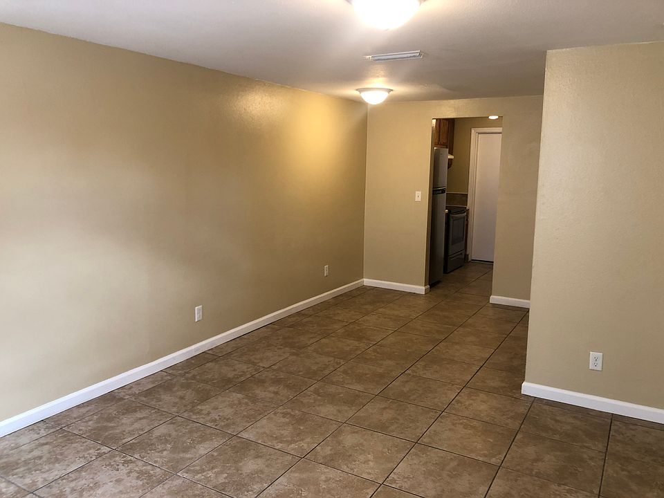 Living and dining area opening into the kitchen.