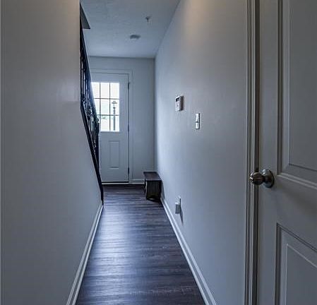 Greet guests in the spacious entrance, also featuring access to the expansive garage.