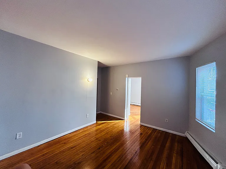 Living Room with wall sconce light and outlet for wall mountable TV