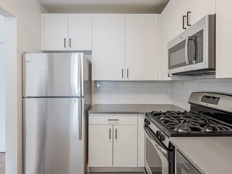 Sleek stainless steel appliances and modern cabinetry