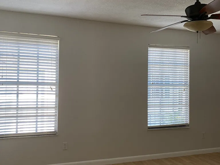 Bright primary bedroom with ample natural light.