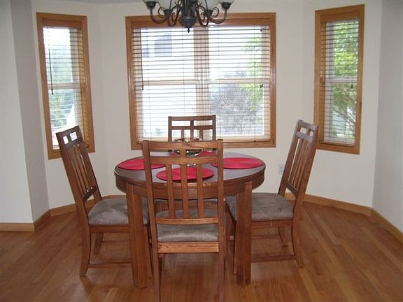 Informal dining bay area off kitchen with formal dining on the other side