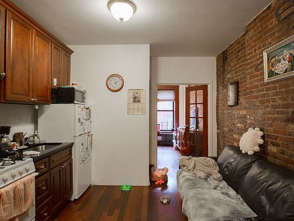 5th image of 231 E 10th St APT 9