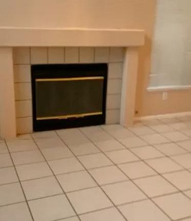 Fireplace in living room with vaulted ceilings