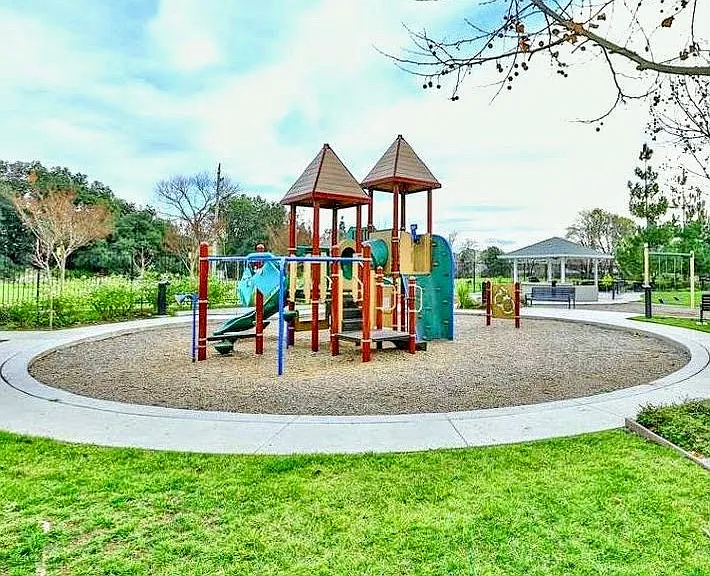 Well-maintained HOA community featuring a play area and BBQ spots.