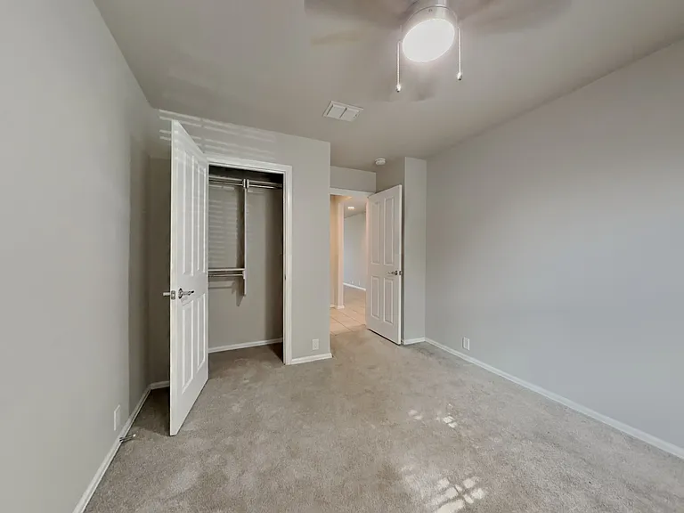 Spacious bedroom with neutral