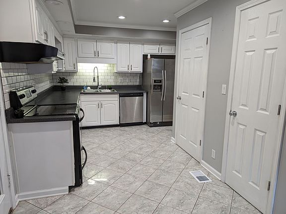 Updated spacious kitchen showing the double pantries