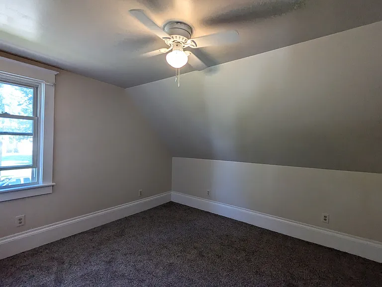 bedroom with new ceiling fan