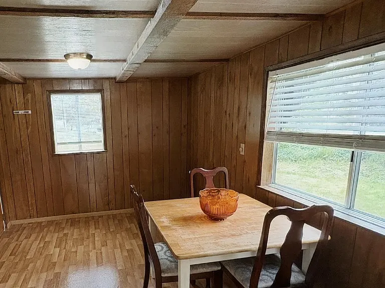 Diningroom with pantry and refrigerator.