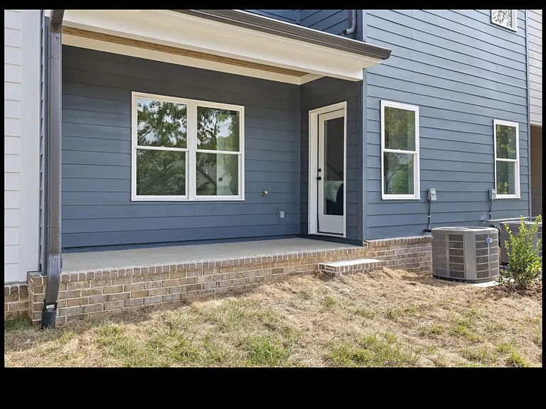 Outdoor patio off living room, perfect for the BBQ grille.
