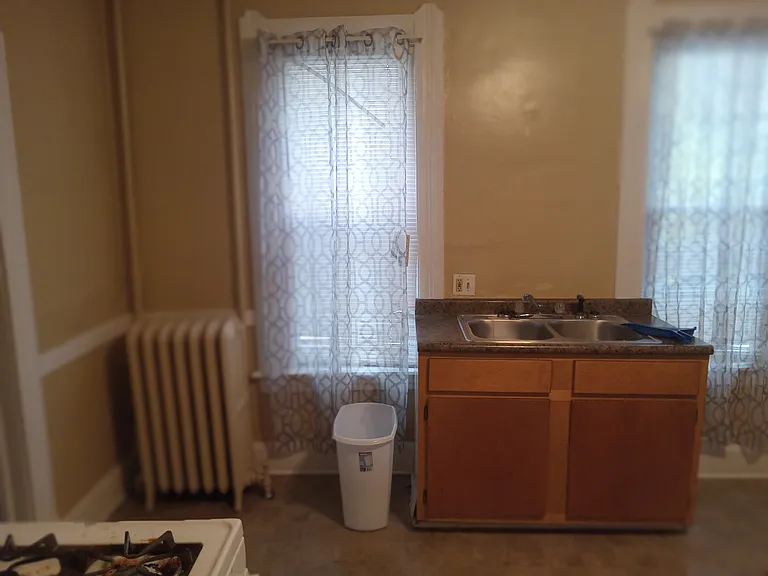 Kitchen to the far left