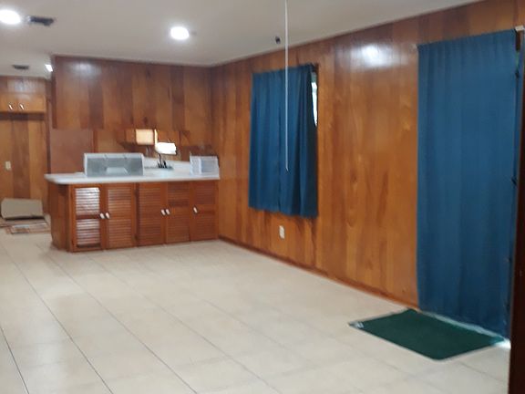 Den with kitchen