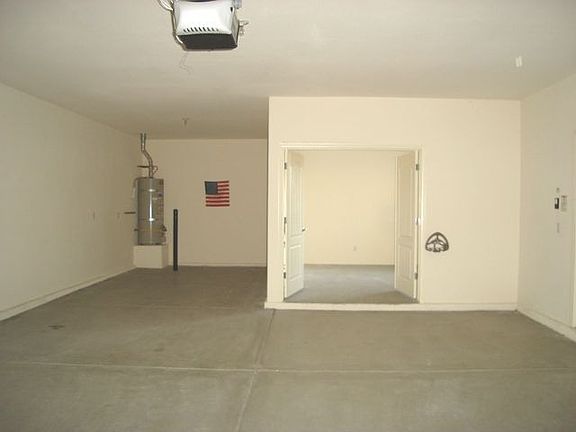 4 CAR GARAGE, 1 BAY w/AC double door workshop!